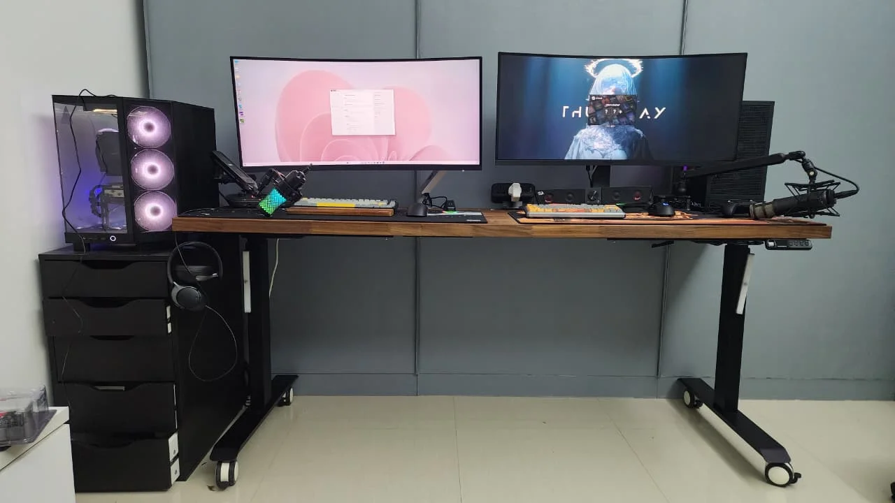 The same walnut-desk setup after FLC's visit, clean and cable-managed